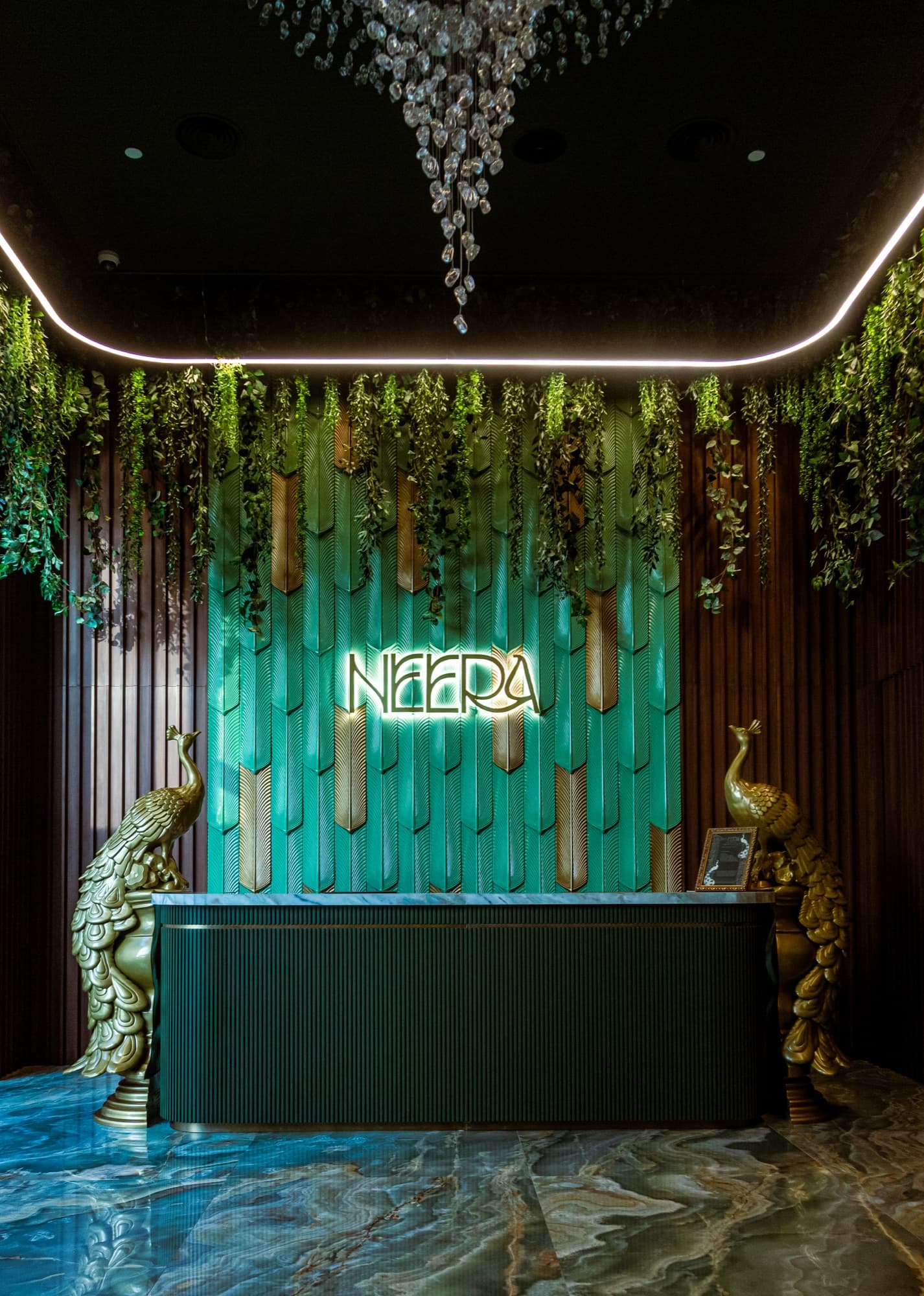 Neera reception with peacock sculptures